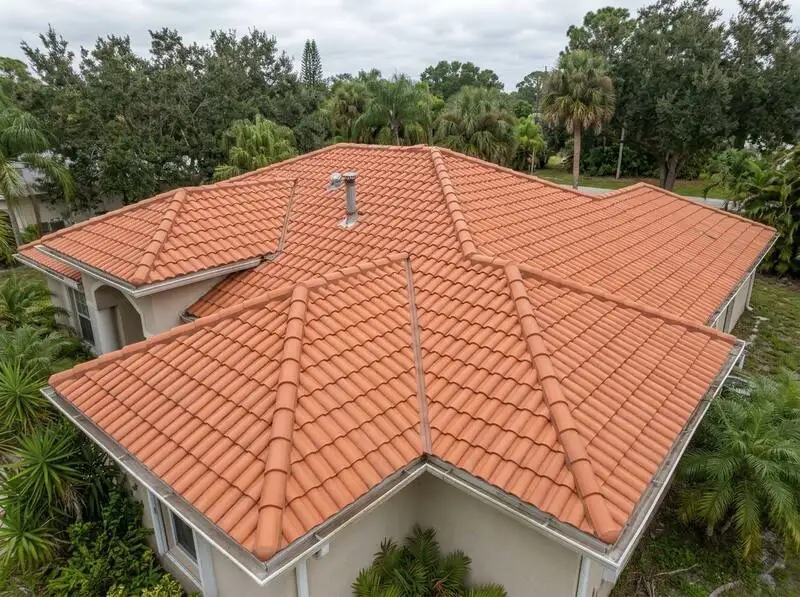 Coral Gables clay tile roof before and after restoration with cracked tile replacement