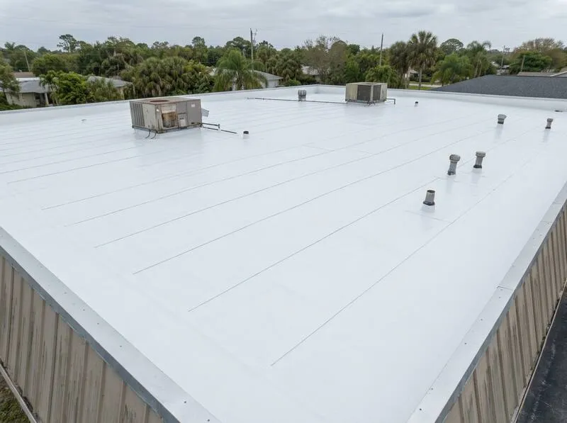 Commercial flat roof before and after TPO membrane repair and reflective coating